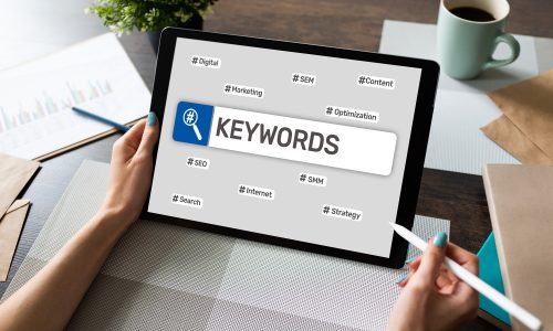 Keywords. SEO, Search engine optimization and internet marketing concept on screen.