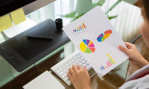 business-woman-working-office-with-financial-diagram_1232-1540
